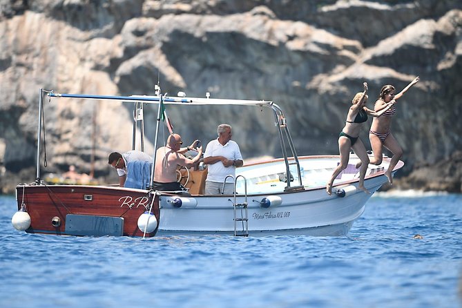 Capri Boat Tour: Grottoes, Swim & Sip Limoncello in a Small Group - Faraglioni and the Arch of Love Pass: The Photo Stop That Feels Like a Movie Scene