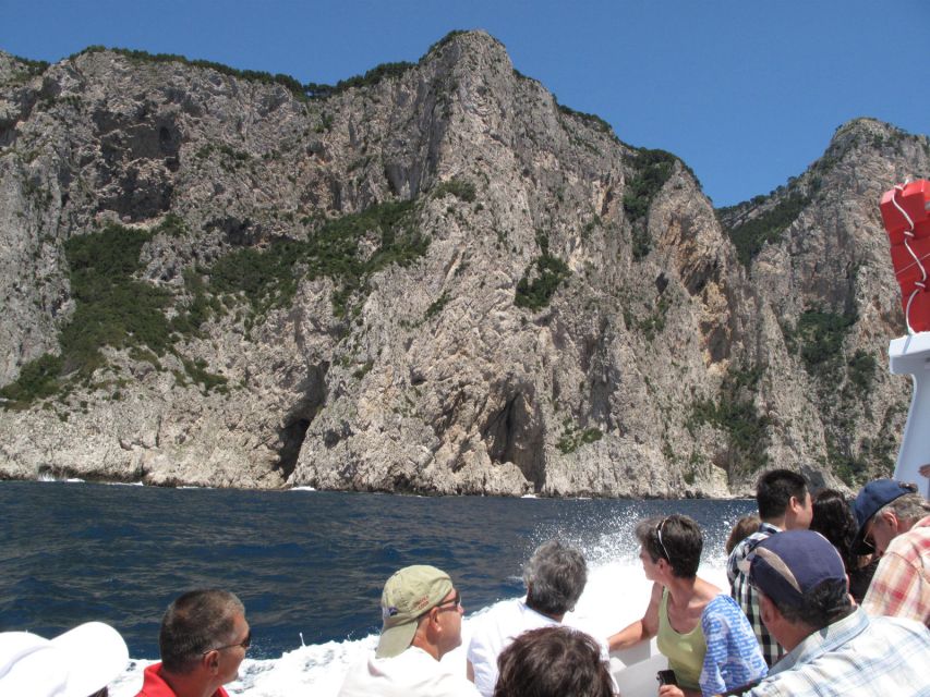 Capri: Private Island Boat Tour with Snorkeling and Swimming - The core loop: Faraglioni Rocks and the Natural Arch from sea level