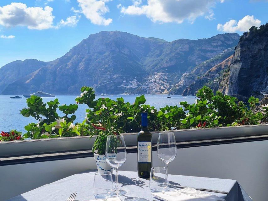 From Amalfi: 7H Amalfi Coast - Group Tour by boat - Conca dei Marini, the Natural Arch, Atrani, and the final photo run