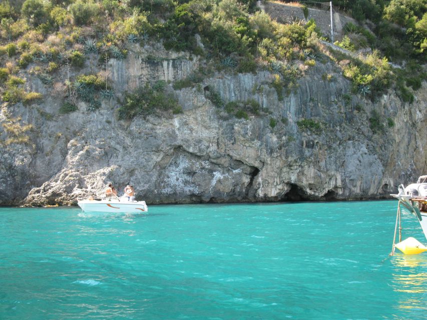 From Amalfi: Day Trip to Capri Private Boat Tour with Drinks - Faraglioni from water level: iconic rocks, real impact