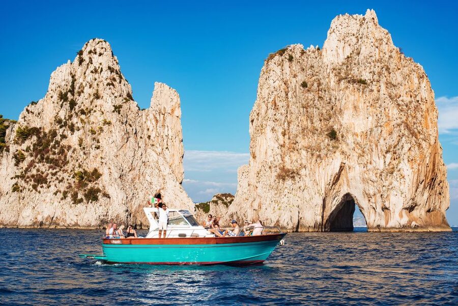 From Amalfi: Small Group Boat Excursion to Capri Island - Capri from the water: leap of Tiberius, grotto passes, and Faraglioni