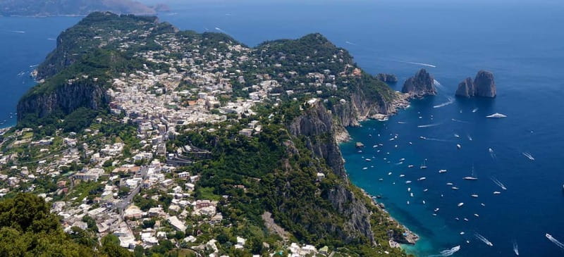 From Naples: Complete Capri Guided Boat and Bus Tour - Capri town and the Piazzetta, then Augustus Gardens for the Faraglioni view