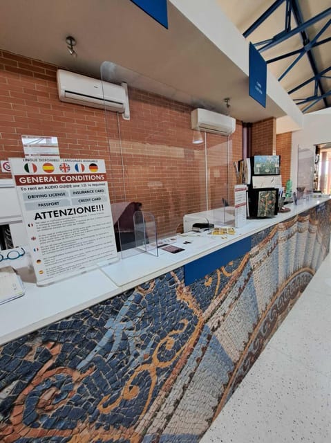 Herculaneum: Entrance tickets + audioguide - Picking up your audioguide at the entrance desk, no wandering required