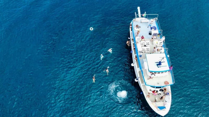 Ischia: Boat tour with swimming stops and lunch on board - Maronti and Scarrupata, then San Pancrazio lunch with a swim built in