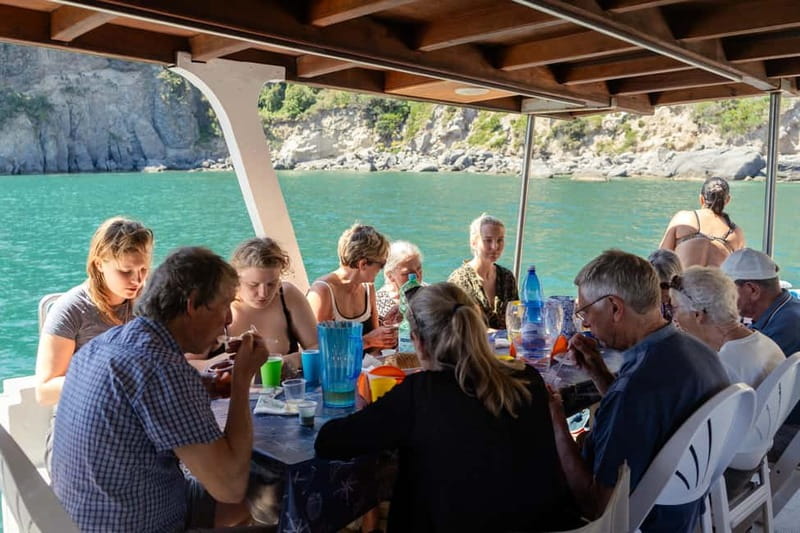 Ischia: Boat tour with swimming stops and lunch on board - Aragonese Castle in front of you, then the Spiaggia dei Pescatori pass