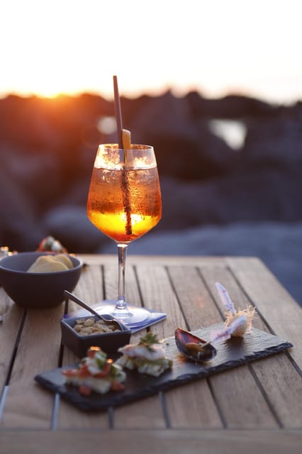 Italian aperitif at the sunset by the sea - The Aperitivo Flow: Where the Time Goes