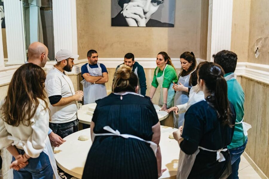 Naples: Pizza-Making Workshop with Drink and Appetizer - Entering Naplesbay Cooking Lab, and getting your hands ready