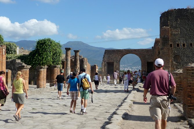 Naples: Pompeii & Mt Vesuvius All-Inclusive Small Group w/ Lunch - Walking Pompeii: baths, the market, and why people painted walls