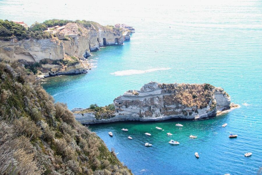 Naples: Sunset Cruise by boat with Aperol Spritz and Snacks - Trentaremi Bay rock formations and the story behind the coastline