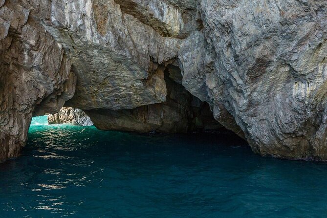 Small Group Capri Island Boat Ride with Swimming and Limoncello - From Marina Grande, set sail on a classic Capri circuit